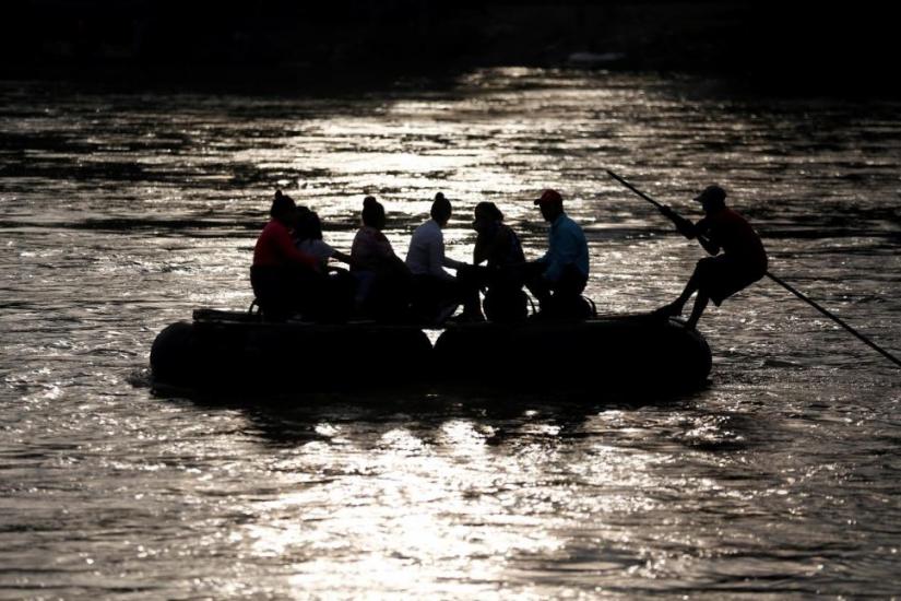 Migrants cross the Suchiate river on a raft from Tecun Uman, in Guatemala, to Ciudad Hidalgo, as seen from Ciudad Hidalgo, Mexico, June 13, 2019. REUTERS
