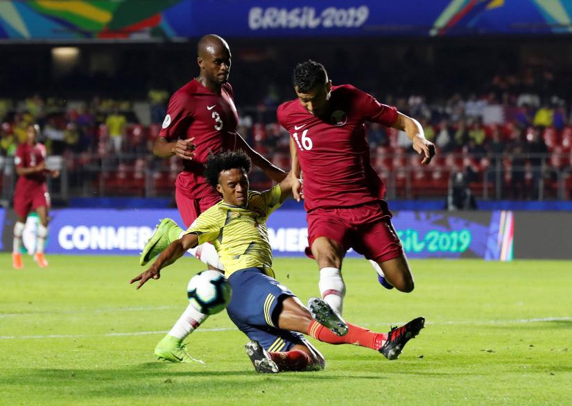 Copa America Brazil 2019 - Group B - Colombia v Qatar - Morumbi Stadium, Sao Paulo, Brazil - June 19, 2019 Colombia`s Juan Cuadrado in action with Qatar`s Boualem Khoukhi REUTERS