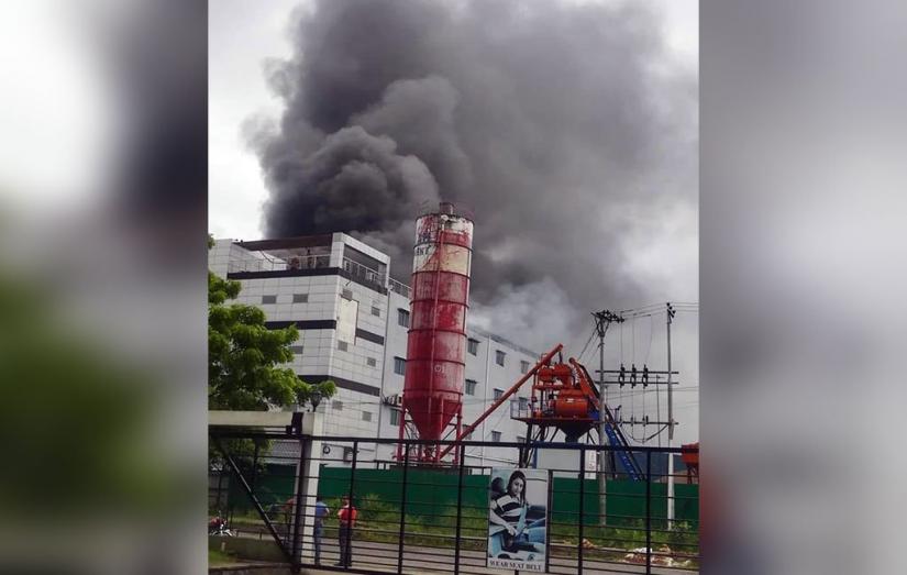 Photo shows smoke is emanating from a sewing factory named Etashia Interlining Limited in Comilla on Saturday, June 22, 2019.