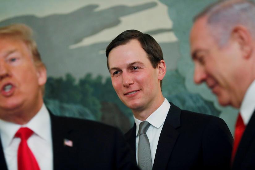 White House senior advisor Jared Kushner smiles while listening to U.S. President Donald Trump talk as the president meets with Israel`s Prime Minister Benjamin Netanyahu at the White House in Washington, U.S., March 25, 2019. REUTERS/File Photo