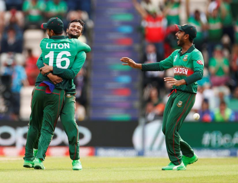 Cricket - ICC Cricket World Cup - Bangladesh v Afghanistan - The Ageas Bowl, Southampton, Britain - June 24, 2019 Bangladesh`s Liton Das celebrates with team mates after taking the catch to dismiss Afghanistan`s Gulbadin Naib Action Images via Reuters