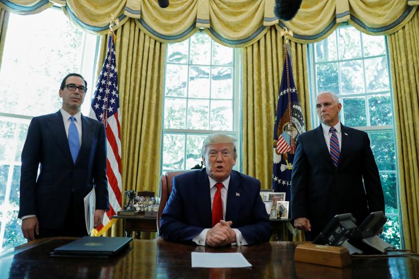 U.S. President Donald Trump speaks before signing an executive order imposing fresh sanctions on Iran as Treasury Secretary Steven Mnuchin and Vice President Mike Pence look on in the Oval Office of the White House in Washington, U.S., June 24, 2019. REUTERS