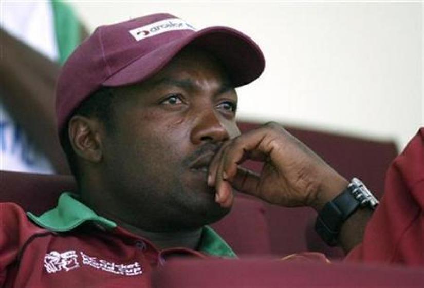 West Indies captain Brian Lara watches from the dressing room as his team loses to Sri Lanka in their World Cup cricket Super Eights match in Georgetown April 1, 2007. REUTERS/File Photo