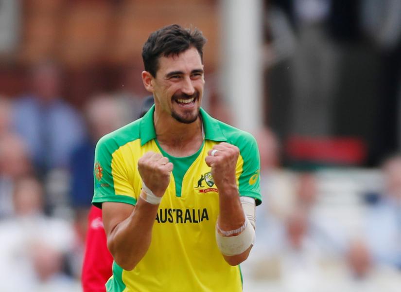 Cricket - ICC Cricket World Cup - England v Australia - Lord`s Cricket Ground, London, Britain - June 25, 2019 Australia`s Mitchell Starc celebrates taking the wicket of England`s Eoin Morgan Action Images via Reuters