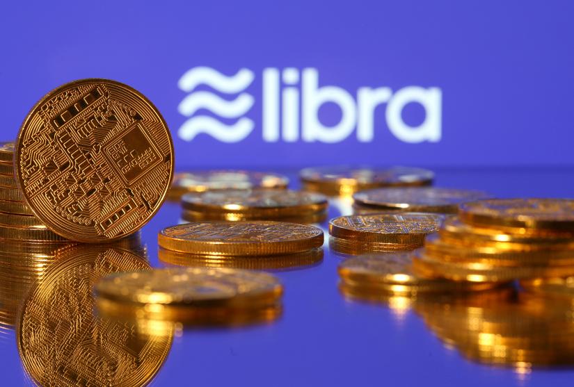 Representations of virtual currency are displayed in front of the Libra logo in this illustration picture, June 21, 2019. REUTERS/Illustration/File Photo