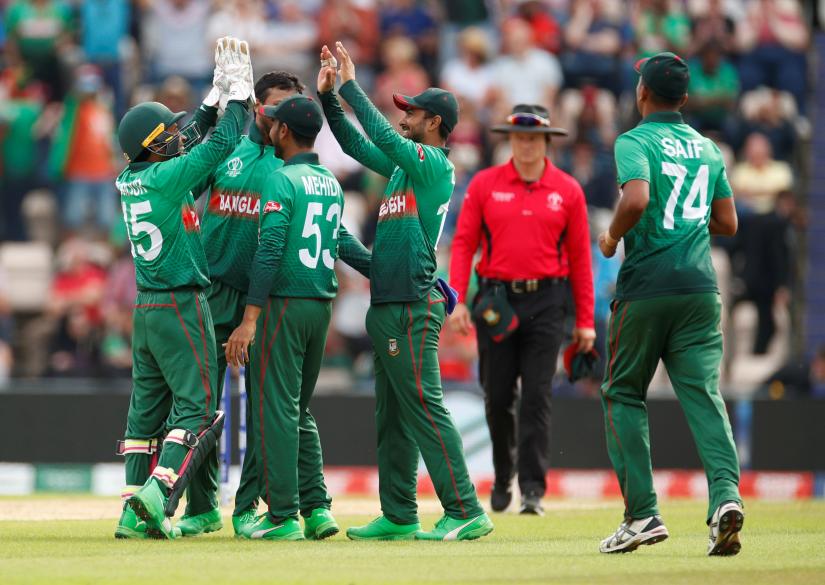 ICC Cricket World Cup - Bangladesh v Afghanistan - The Ageas Bowl, Southampton, Britain - June 24, 2019 Bangladesh`s Liton Das celebrates with team mates after taking the catch to dismiss Afghanistan`s Gulbadin Naib Action Images via Reuters