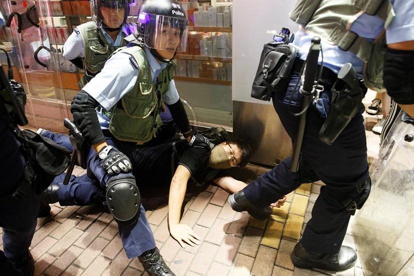 Riot police detain an anti-extradition bill protester after a march at Hong Kong’s tourism district Nathan Road near Mongkok, China July 7, 2019. REUTERS