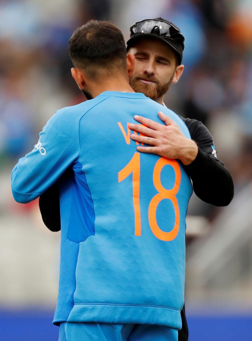 Cricket - ICC Cricket World Cup Semi Final - India v New Zealand - Old Trafford, Manchester, Britain - July 10, 2019 New Zealand`s Kane Williamson shakes hands with India`s Virat Kohli after the match Action Images via Reuters