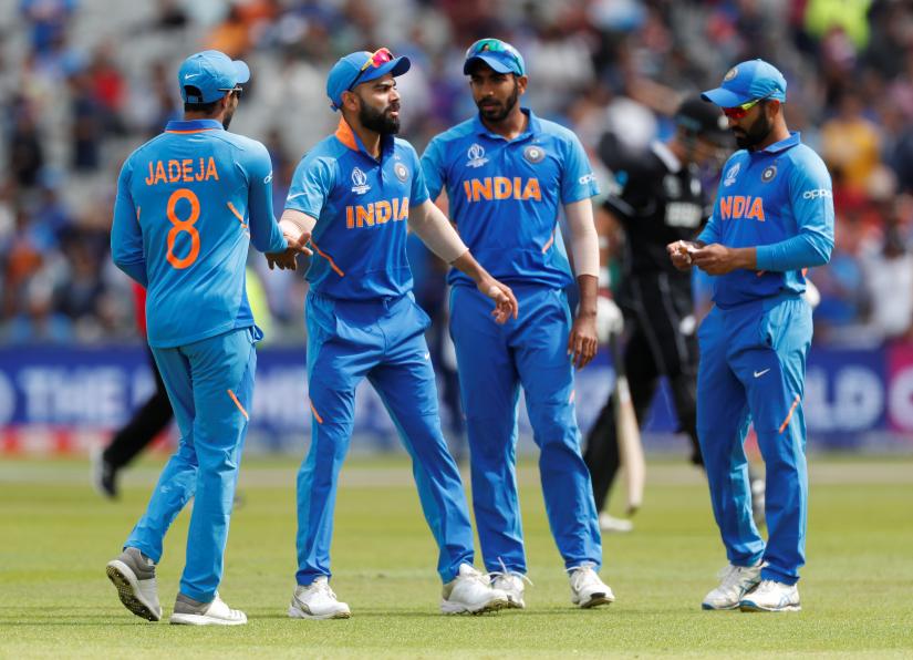 Cricket - ICC Cricket World Cup Semi Final - India v New Zealand - Old Trafford, Manchester, Britain - July 10, 2019 India`s Virat Kohli and team mates after New Zealand`s innings Action Images via Reuters