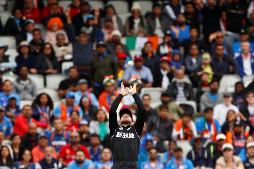 Cricket - ICC Cricket World Cup Semi Final - India v New Zealand - Old Trafford, Manchester, Britain - July 10, 2019 New Zealand`s Kane Williamson catches out India`s Hardik Pandya Action Images via Reuters