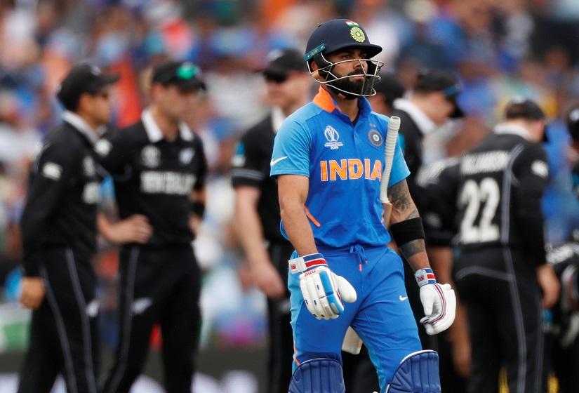 Cricket - ICC Cricket World Cup Semi Final - India v New Zealand - Old Trafford, Manchester, Britain - July 10, 2019 India`s Virat Kohli reacts after losing his wicket Action Images via Reuters