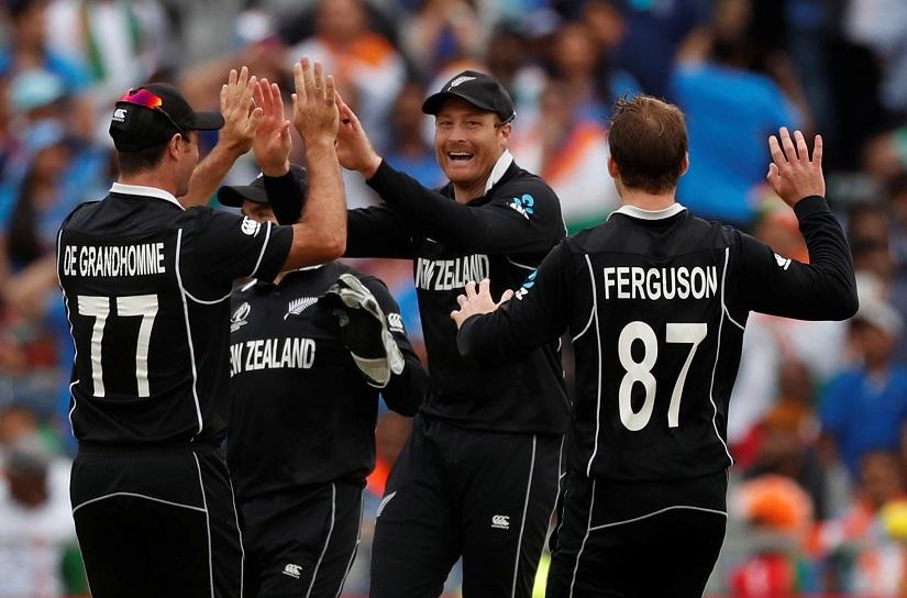 Cricket - ICC Cricket World Cup Semi Final - India v New Zealand - Old Trafford, Manchester, Britain - July 10, 2019 New Zealand`s Martin Guptill celebrates with team mates after taking the wicket of India`s MS Dhoni Action Images via Reuters