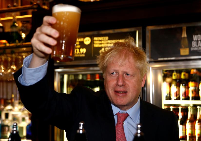 Boris Johnson, a leadership candidate for Britain`s Conservative Party, visits Wetherspoons Metropolitan Bar in London, Britain, July 10, 2019. REUTERS