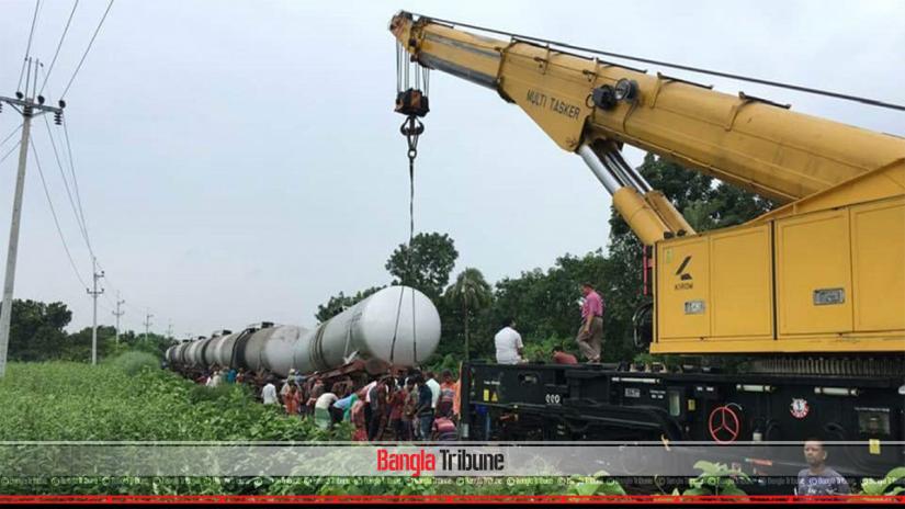 The picture shows that rescue operation is underway following the derailment of nine bogies of an oil-laden train heading towards Rajshahi from Pabna, July 11, 2019.