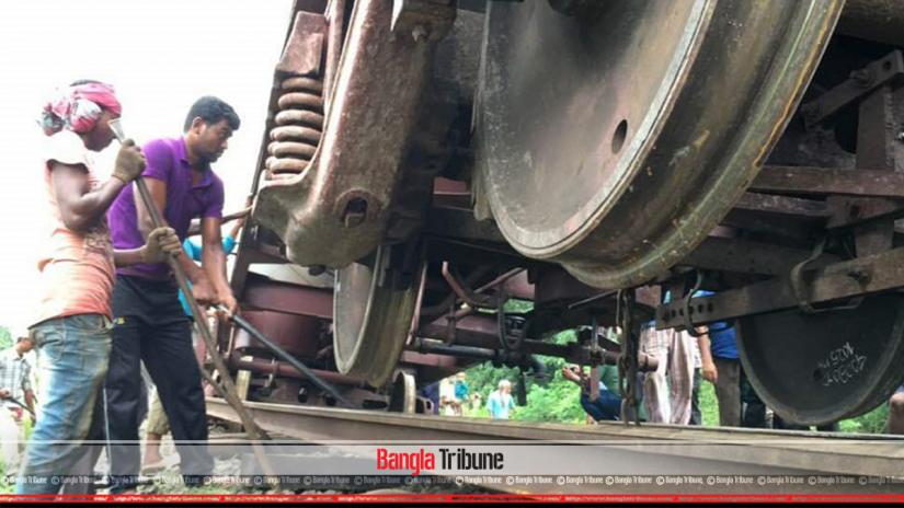 The picture shows that rescue operation is underway following the derailment of nine bogies of an oil-laden train heading towards Rajshahi from Pabna, July 11, 2019.