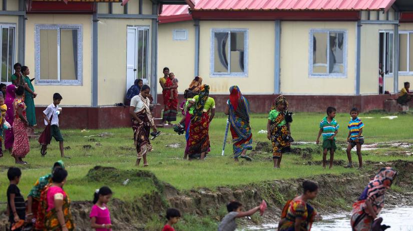Displaced Hindu people are pictured next to new houses, built by Indian and Myanmar governments friendship project, in Maungdaw, Rakhine, Myanmar, July 9, 2019. REUTERS