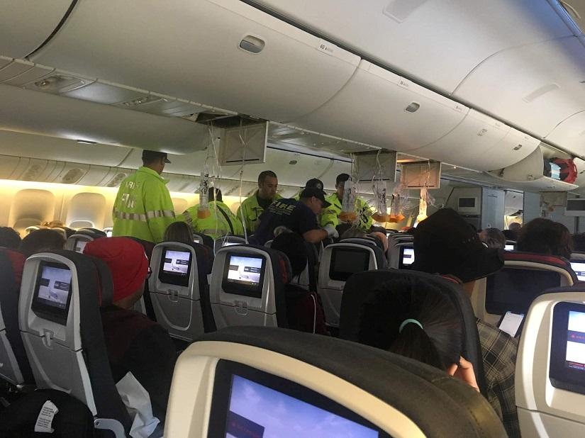 Emergency workers assist passengers of Air Canada AC 33 flight, which diverted to Hawaii after turbulence, at Honolulu airport, Hawaii, U.S., July 11, 2019 in this image obtained from social media. Australian Band – Hurricane Fall via REUTERS