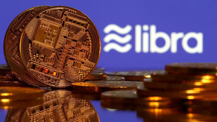 Representations of virtual currency are displayed in front of the Libra logo in this illustration picture, Jun 21, 2019. REUTERS/Illustration/File Photo