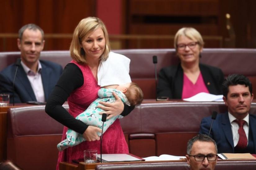 Australian senator Larissa Waters puts forward a motion while breastfeeding her daughter Alia Joy on Thursday(Jun 22), 2017.