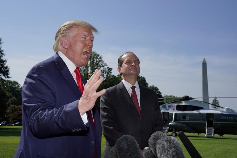 US President Donald Trump announces the resignation of Labor Secretary Alex Acosta (R) before departing for travel to Milwaukee, Wisconsin from the South Lawn of the White House in Washington, US, July 12, 2019. REUTERS