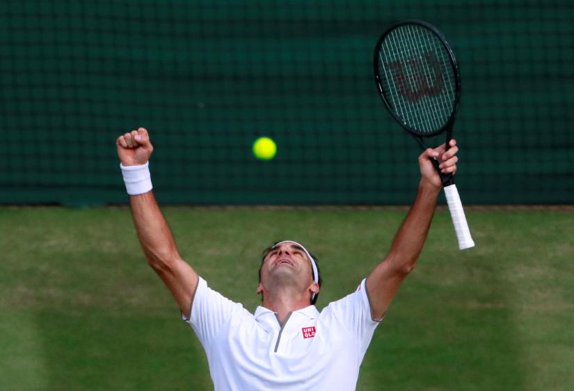 Wimbledon - All England Lawn Tennis and Croquet Club, London, Britain - July 12, 2019 Switzerland`s Roger Federer celebrates after winning his semi-final match against Spain`s Rafael Nadal REUTERS