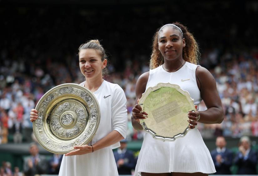 Tennis - Wimbledon - All England Lawn Tennis and Croquet Club, London, Britain - July 13, 2019 Romania`s Simona Halep and Serena Williams of the U.S. pose with their trophies after the final REUTERS