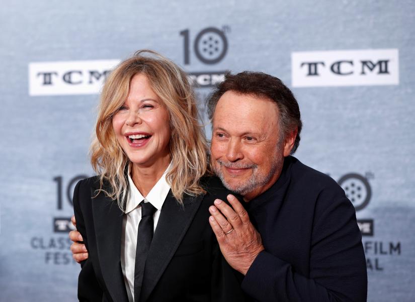 Cast members Billy Crystal and Meg Ryan pose as they arrive for the 30th anniversary screening of comedy movie `When Harry Met Sally` in Hollywood, California, U.S. April 11, 2019. REUTERS/File Photo