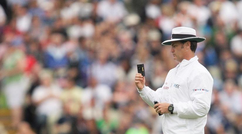 Umpire Simon Taufel looks at a light meter before coming off for bad light Mandatory - England v India npower Test Series Third Test - Edgbaston - Aug 12, 2011. Andrew Boyers/File Photo/Reuters