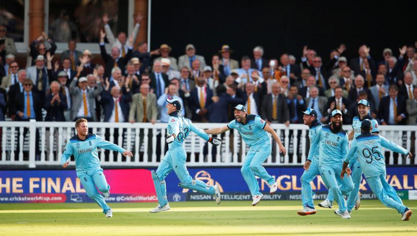 Cricket - ICC Cricket World Cup Final - New Zealand v England - Lord`s, London, Britain - July 14, 2019 England`s Jos Buttler celebrates winning the world cup with team mates after running out New Zealand`s Martin Guptill Action Images via Reuters