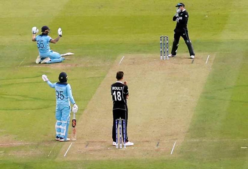 Ben Stokes apologises after Martin Guptill`s throw from deep midwicket ricocheted off his bat and flew to the boundary for a total of six overthrows. Reuters