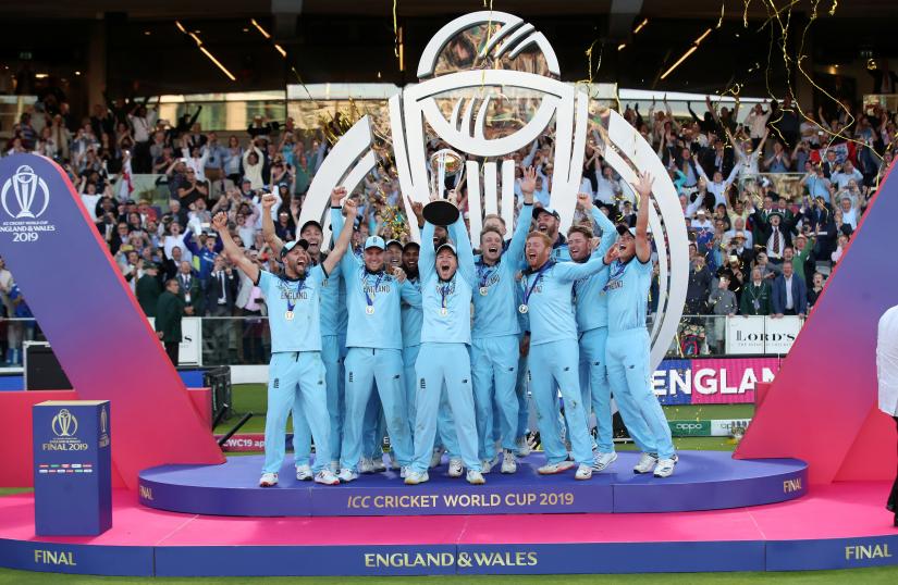 Cricket - ICC Cricket World Cup Final - New Zealand v England - Lord`s, London, Britain - July 14, 2019 England`s Eoin Morgan and team mates celebrate winning the world cup with the trophy Action Images via Reuters