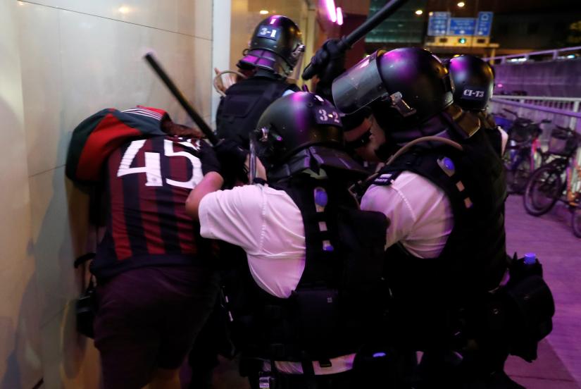 Riot police detain a pro-democracy activist after a march at Sha Tin District of East New Territories, Hong Kong, China July 14, 2019. REUTERS