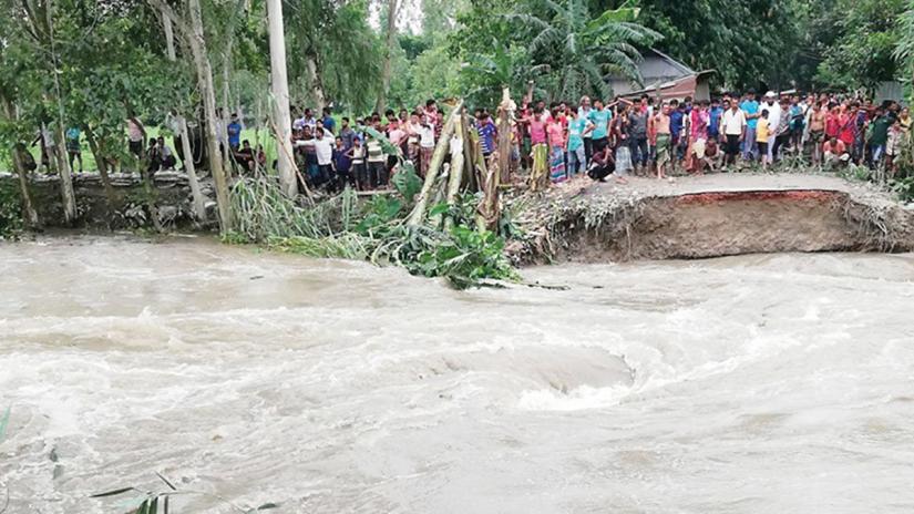 A portion of the embankment in Godarhat area at Gaibandha’s Kholahati union washed away due to high water pressure in Ghagot River on Monday, July 15, 2019.