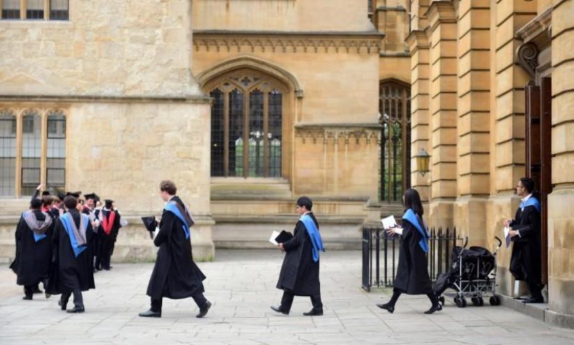 Graduates leave the Sheldonian Theatre after a graduation ceremony at Oxford University, Britain July 15, 2017. REUTERS/File photo