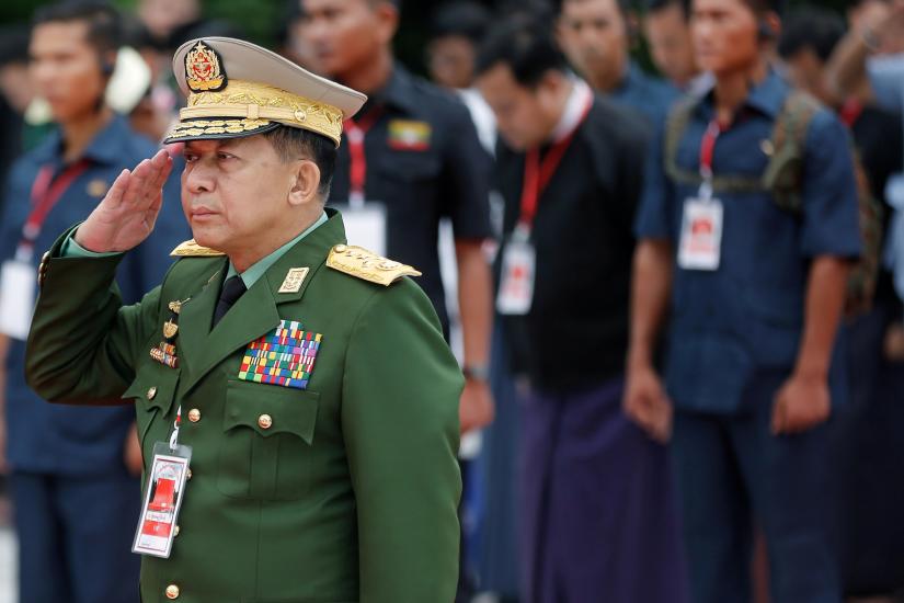 FILE PHOTO: Myanmar`s Commander in Chief Senior General Min Aung Hlaing salutes as he attends an event marking Martyrs` Day at Martyrs` Mausoleum in Yangon, Myanmar July 19, 2018. REUTERS/File Photo