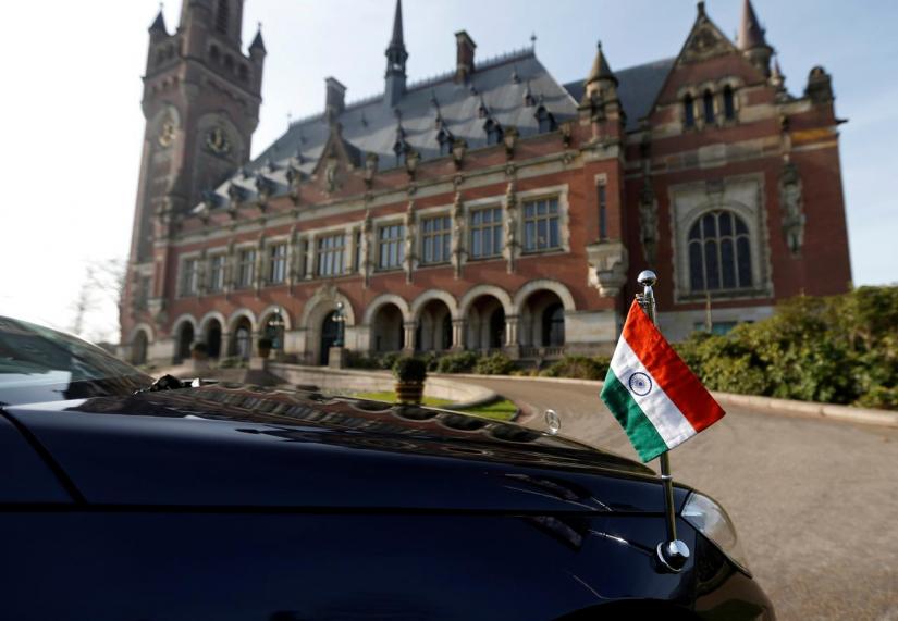 A car with the Indian flag is parked outside the International Court of Justice during the final hearing of the Kulbhushan Jadhav case in The Hague, the Netherlands, Feb 18, 2019. REUTERS/File Photo