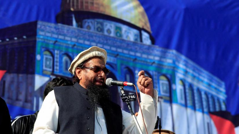Hafiz Muhammad Saeed (C), chief of the Islamic charity organisation Jamaat-ud-Dawa (JuD), speaks to supporters during a gathering to protest against Trump`s decision to recognise Jerusalem as the capital of Israel, in Rawalpindi, Pakistan Dec 29, 2017. REUTERS/File Photo