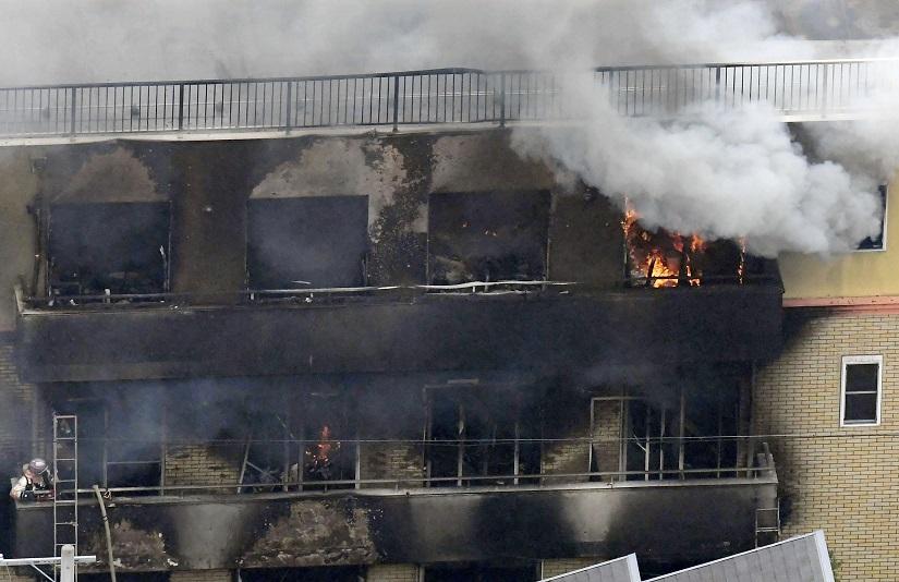 An aerial view shows smoke and flame rise from the three-story Kyoto Animation building which was torched in Kyoto, western Japan, in this photo taken by Kyodo July 18, 2019. Mandatory credit Kyodo/via REUTERS