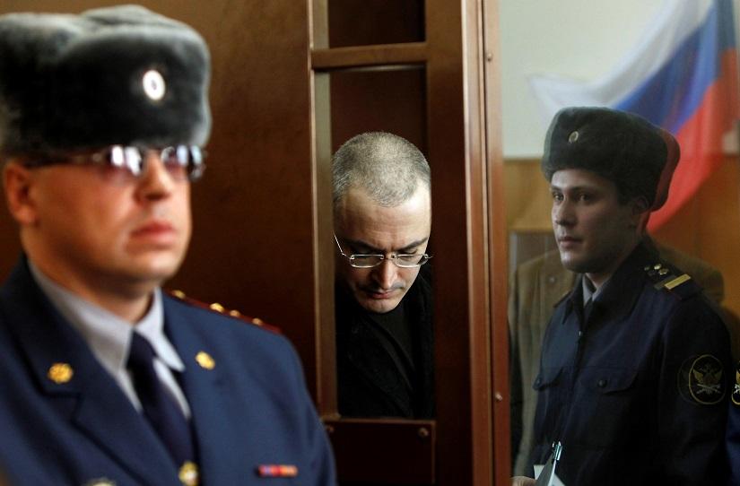 Russian oil tycoon Mikhail Khodorkovsky stands before a court session starts in a court in Moscow, Russia, Apr 6, 2010. REUTERS/File Photo