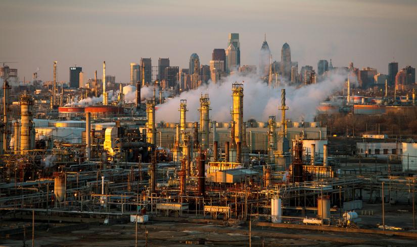The Philadelphia Energy Solutions oil refinery is seen at sunset in front of the Philadelphia skyline March 24, 2014. REUTERS/File Photo
