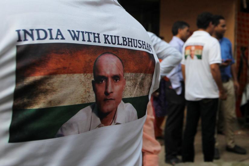 People wait before the issue of a verdict in the case of Indian national Kulbhushan Jadhav by International Court of Justice, in Mumbai, India, July 17, 2019. REUTERS