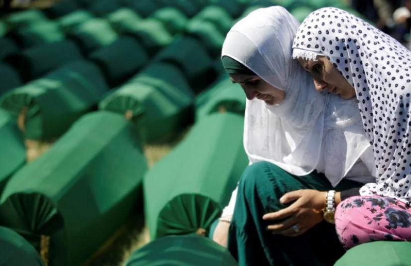Muslim women cry near coffins of their relatives, who are newly identified victims of the 1995 Srebrenica massacre, which are lined up for a joint burial in Potocari near Srebrenica, Bosnia and Herzegovina Jul 11, 2016. REUTERS/File Photo