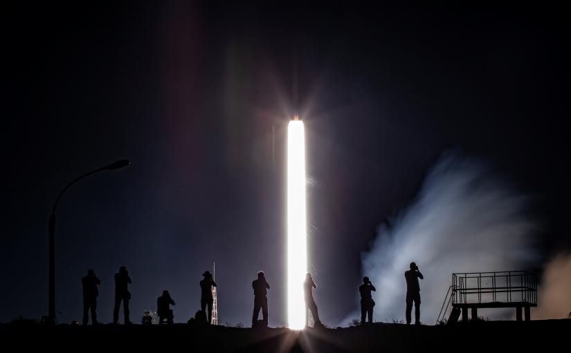 Photographers take pictures as the Soyuz MS-13 spacecraft carrying the crew formed of Andrew Morgan of NASA, Alexander Skvortsov of the Russian space agency Roscosmos and Luca Parmitano of European Space Agency blasts off to the International Space Station (ISS) from the launchpad at the Baikonur Cosmodrome, Kazakhstan July 20, 2019. REUTERS