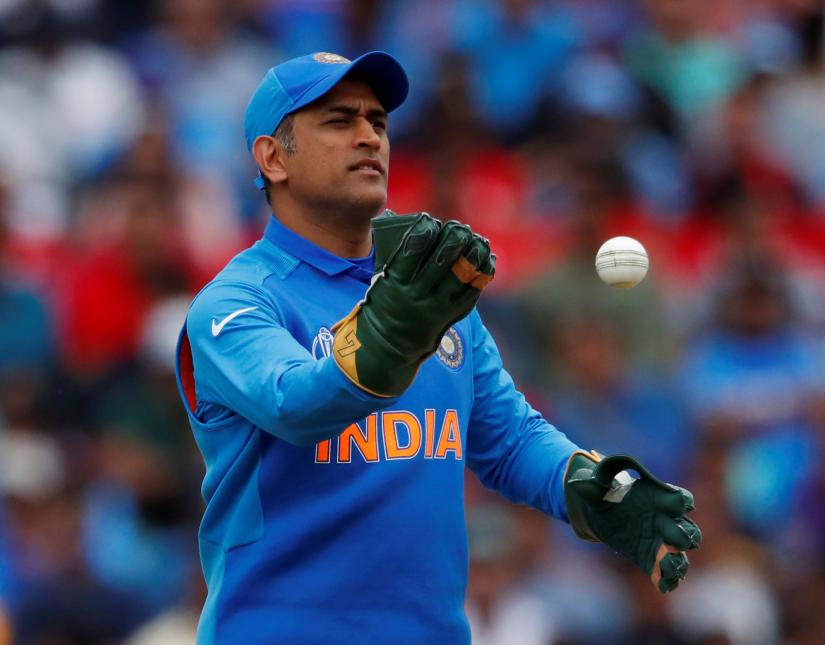 India`s MS Dhoni wearing his new gloves without an emblem on them - ICC Cricket World Cup - India v Australia - The Oval, London, Britain - June 9, 2019. Reuters/File Photo