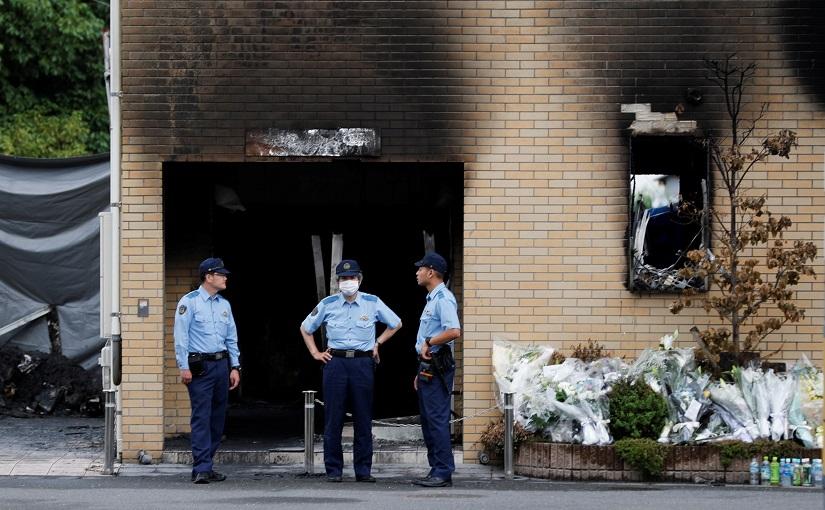 Policemen are seen at the torched Kyoto Animation building in Kyoto, Japan, July 20, 2019. REUTERS