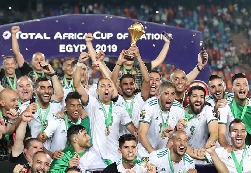 Soccer Football - Africa Cup of Nations 2019 - Final - Senegal v Algeria - Cairo International Stadium, Cairo, Egypt - July 19, 2019 Algeria`s Riyad Mahrez lifts the trophy as they celebrate winning the Africa Cup of Nations. REUTERS