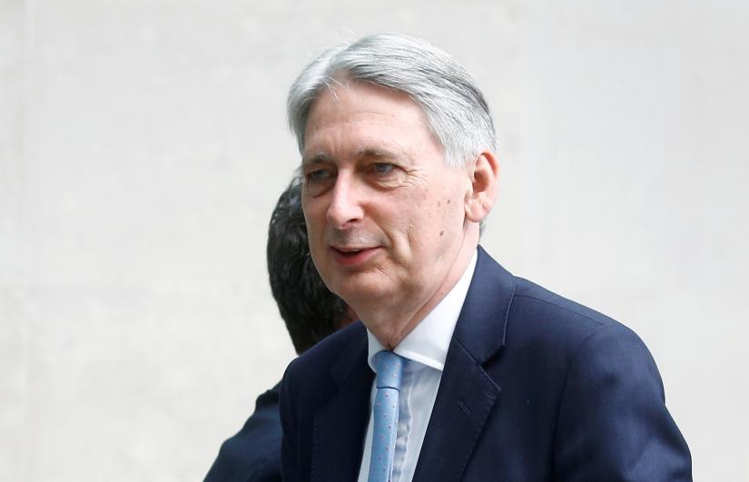Britain`s Chancellor of the Exchequer Philip Hammond arrives at the BBC studios in London, Britain, July 21, 2019. REUTERS