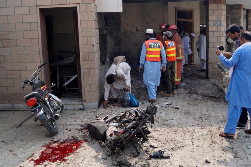 Rescue workers and police officers gather after a suicide blast at the premises of the Civil Hospital in Dera Ismail Khan, Pakistan July 21, 2019. REUTERS