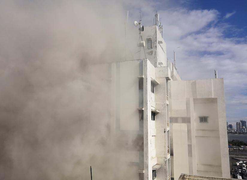Smoke is seen coming out of a Mahanagar Telephone Nigam Limited (MTNL) building after a fire broke out, in Mumbai, India July 22, 2019. REUTERS