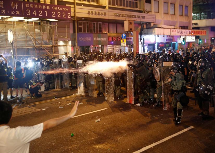 Riot police fire tear gas, after a march to call for democratic reforms in Hong Kong, China July 21, 2019. REUTERS